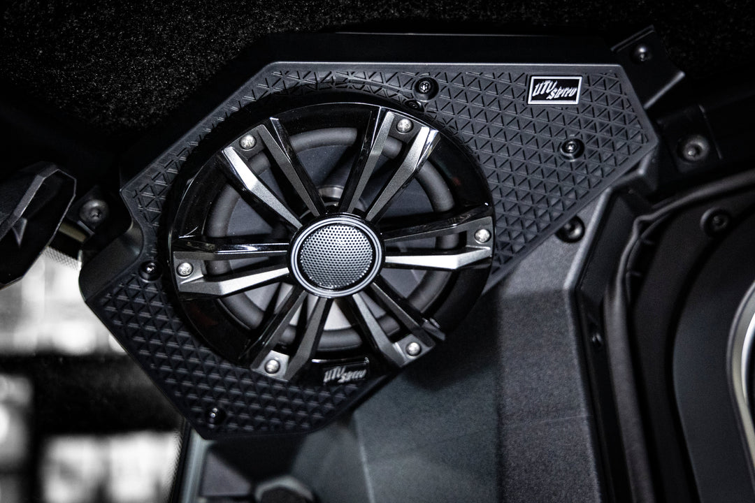 UTV Stereo speaker mounted in a black textured housing