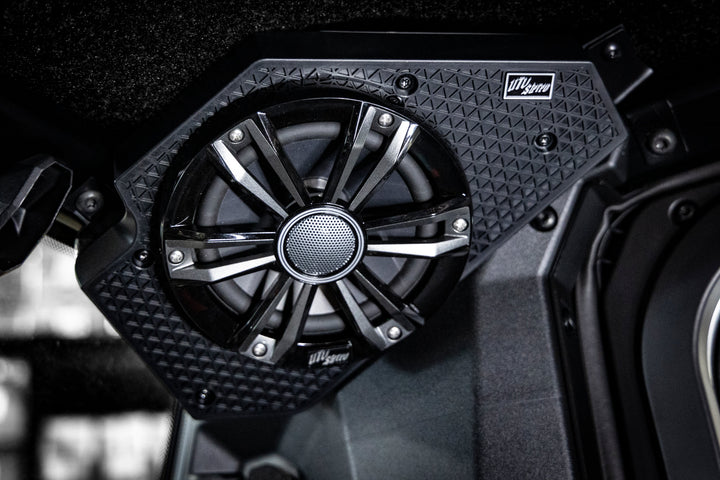 UTV Stereo speaker mounted in a black textured housing