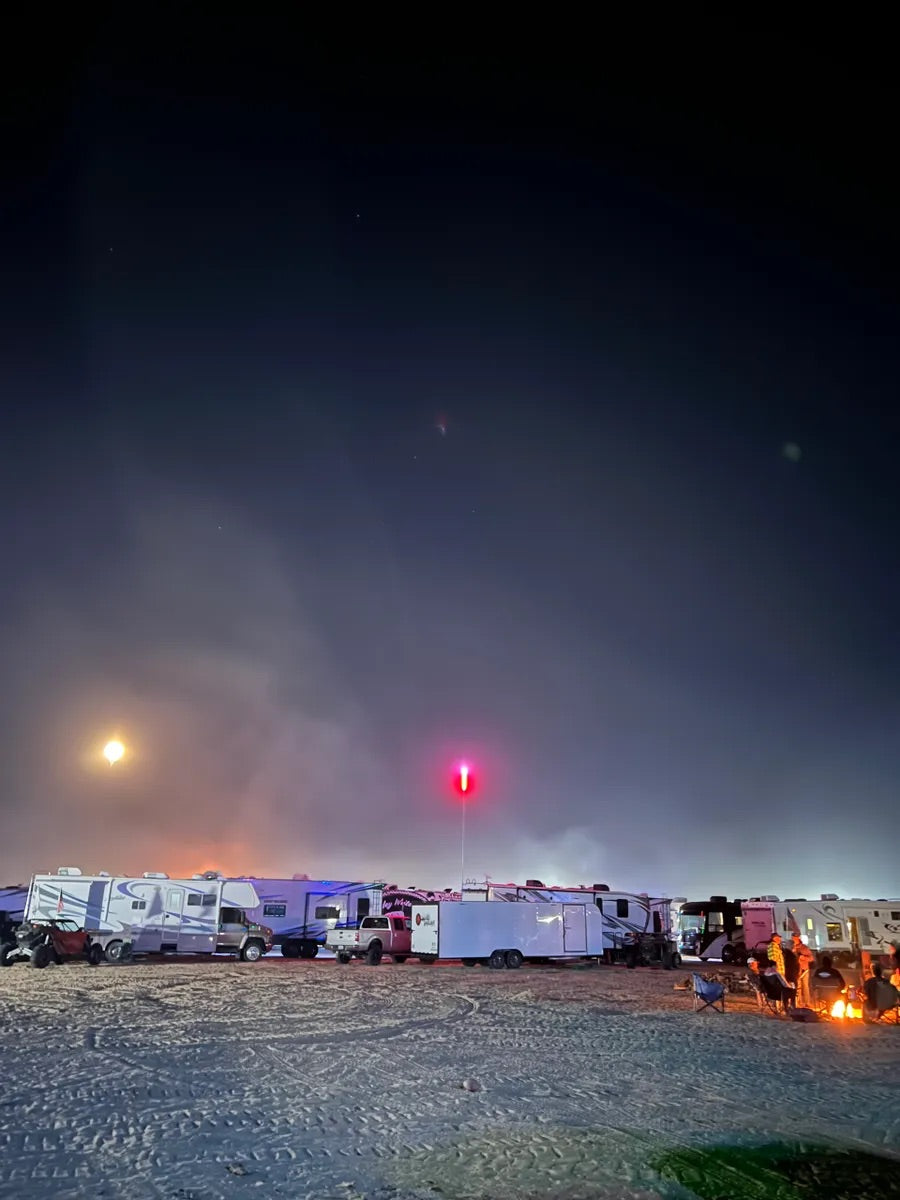 RV campsite at night with CAMP LOCATORS