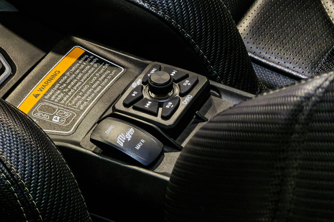 UTV Stereo media controller and rocker switch installed in vehicle center console