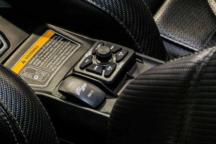 UTV Stereo media controller and rocker switch installed in vehicle center console
