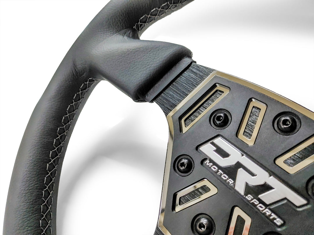 Details of a Round utv steering wheel in leather finish