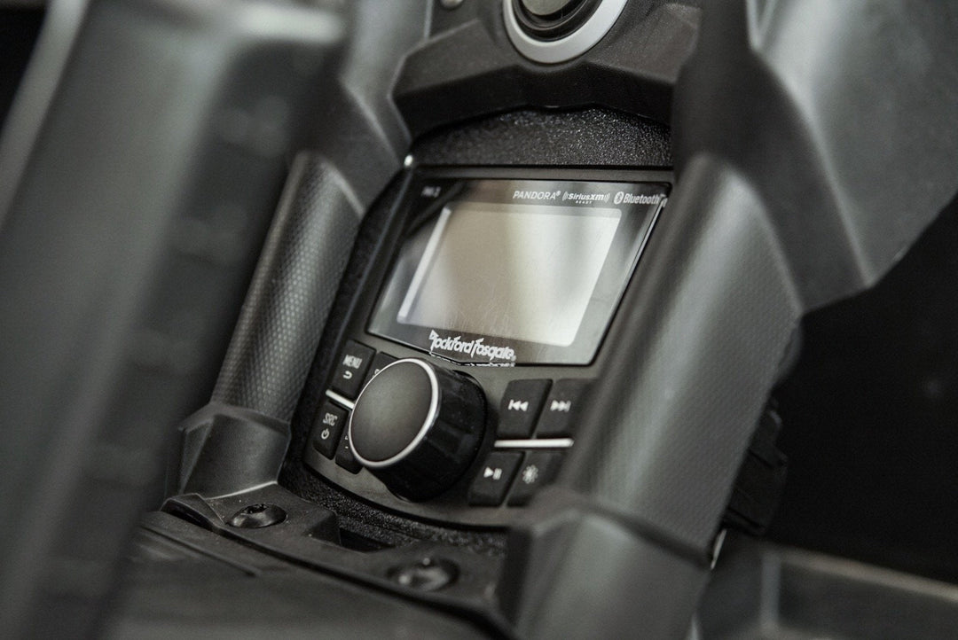Rockford Fosgate digital media receiver installed in a vehicle dashboard