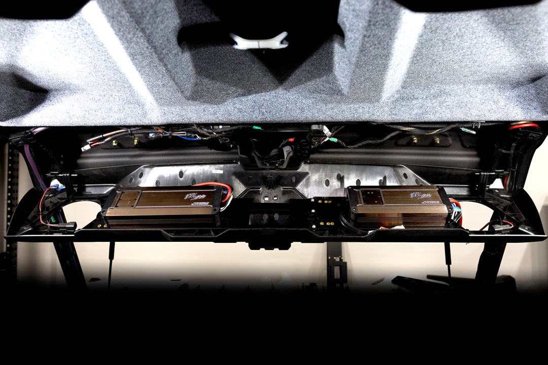 Two UTV Stereo Elite Series amplifiers mounted in a vehicle roof panel