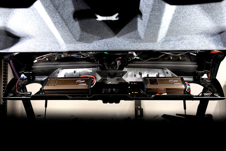 Two UTV Stereo Elite Series amplifiers mounted in a vehicle roof panel