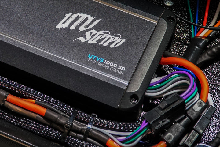 UTV Stereo UTVS1000 5D full range digital amplifier with connected wiring harness