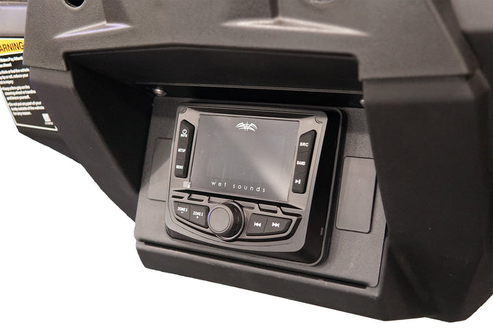 Wet Sounds digital media receiver mounted in a black vehicle dashboard