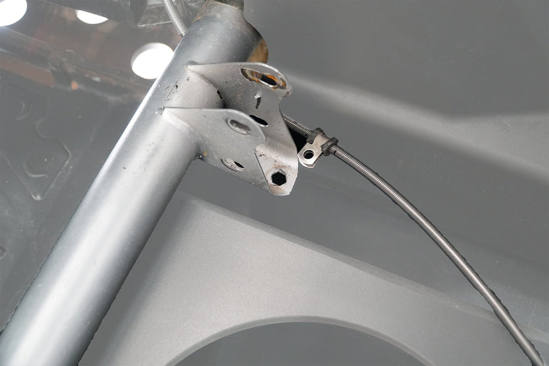 UTV Stereo metal mounting bracket attached to vehicle roll cage frame
