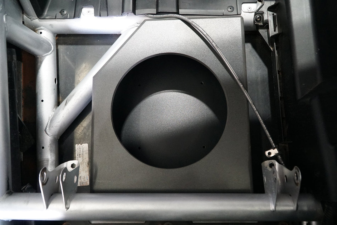 UTV Stereo subwoofer enclosure mounted in vehicle frame