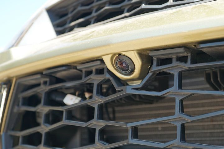 Front facing vehicle camera mounted on the honeycomb grille