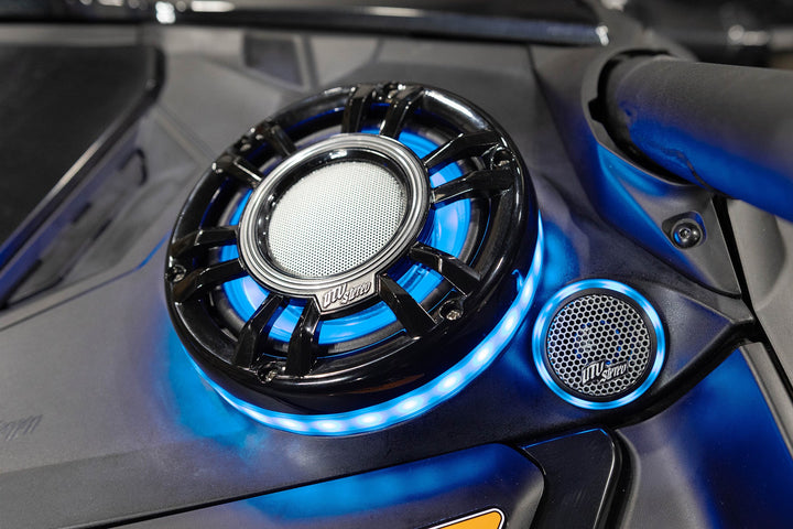 UTV Stereo speaker system with blue LED ring lighting installed in a vehicle dashboard