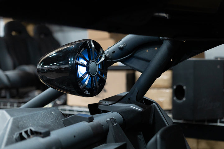 Wet Sounds tower speaker with blue LED lighting mounted on a vehicle roll cage