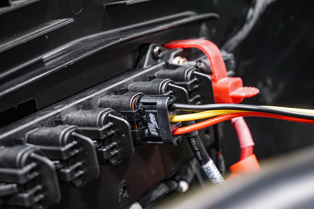 Automotive electrical connector block with black yellow and red wires