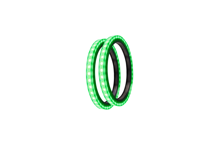 Two circular green LED light rings angled against a white background