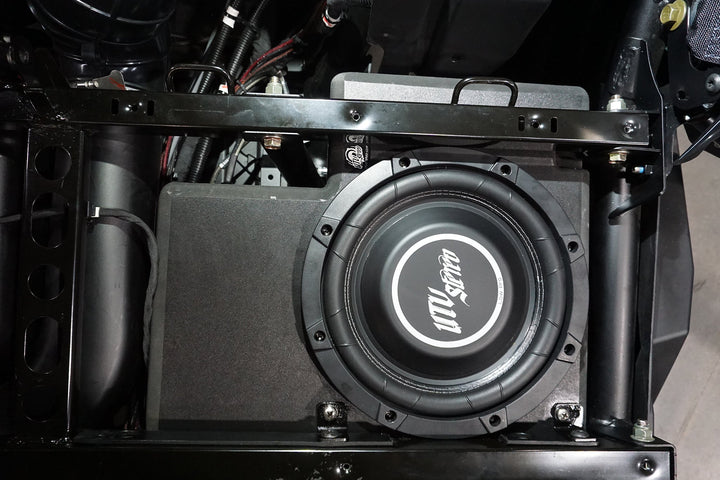 UTV Stereo Low Pro subwoofer installed in a vehicle frame