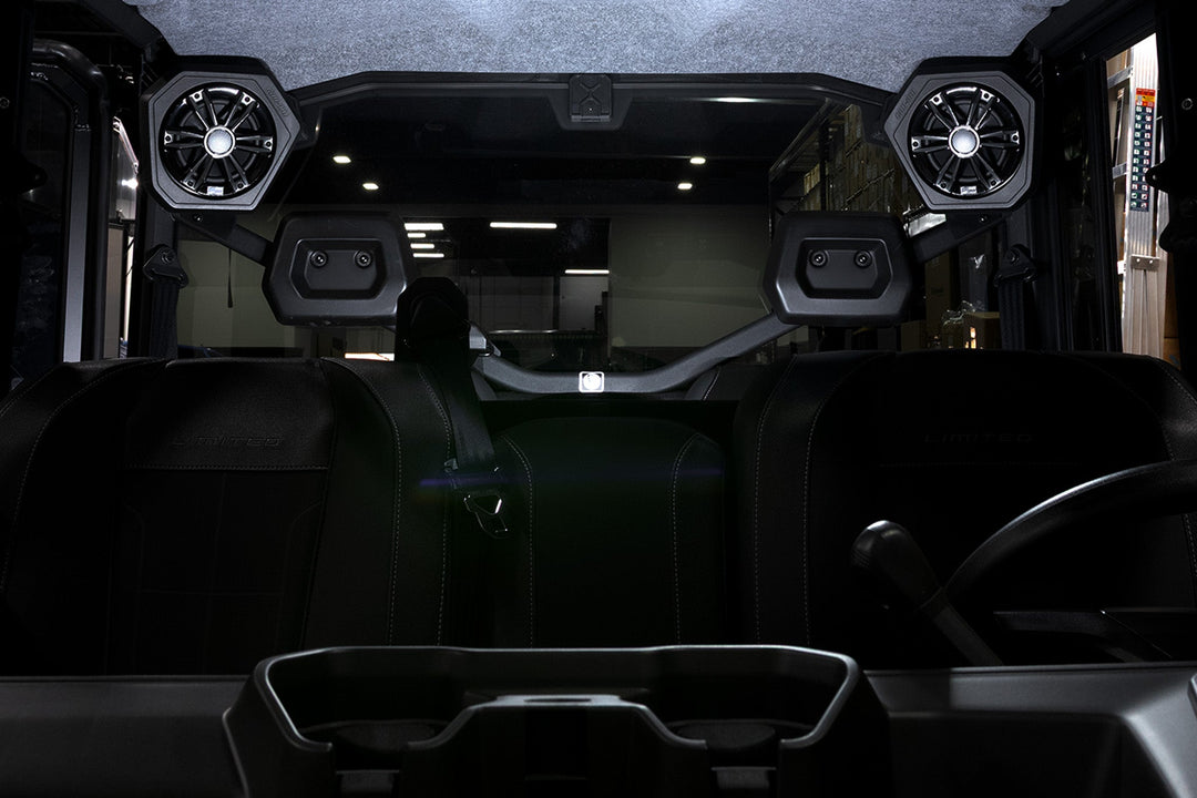 Can-Am off-road vehicle interior with overhead mounted audio speakers