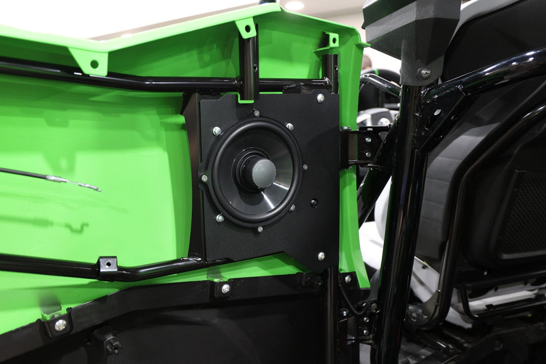 UTV Stereo speaker mounted on a green vehicle door panel
