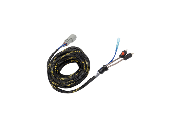Coiled black and yellow braided wiring harness with grey connector and RCA plugs