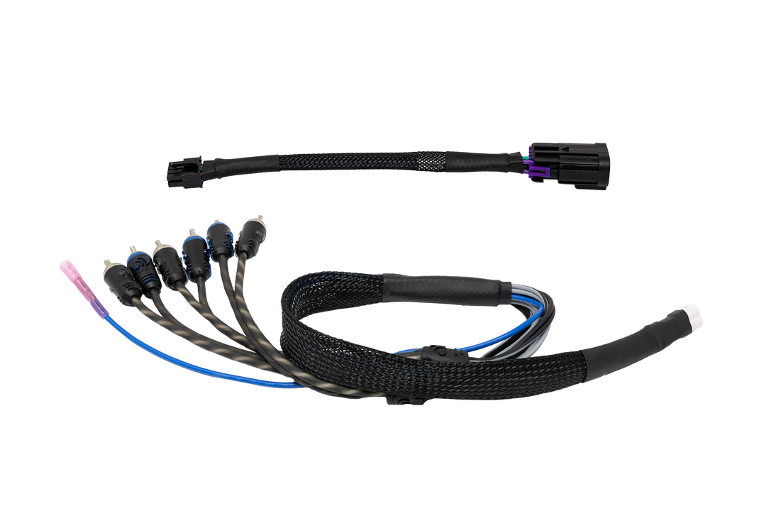 Vehicle audio wiring harness adapter with RCA connectors and black braided cable sleeve
