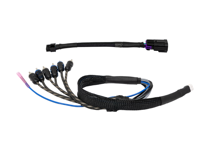 Vehicle audio wiring harness adapter with RCA connectors and black braided cable sleeve