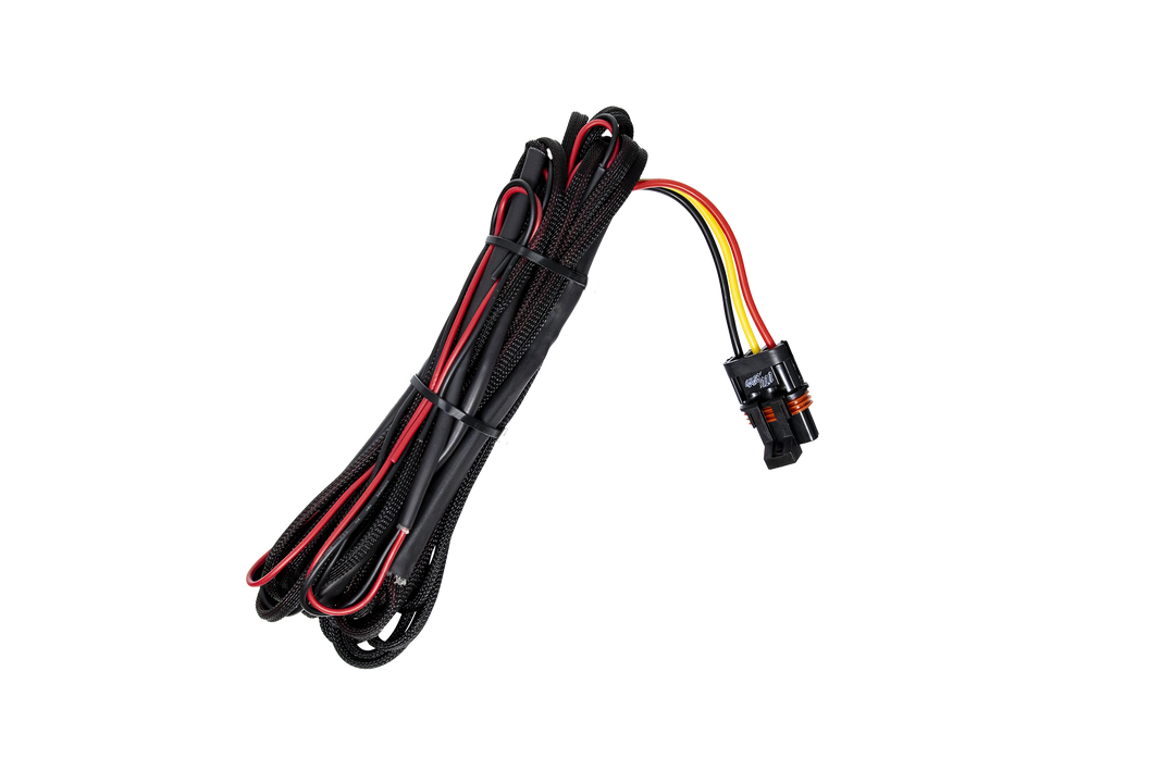Black braided wiring harness with red and yellow wires and a black plastic connector