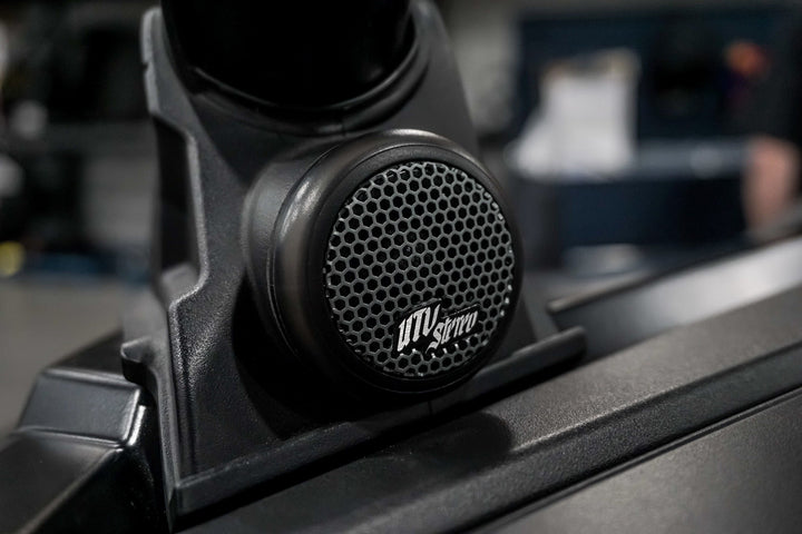 UTV Stereo tweeter speaker mounted on a black vehicle dash