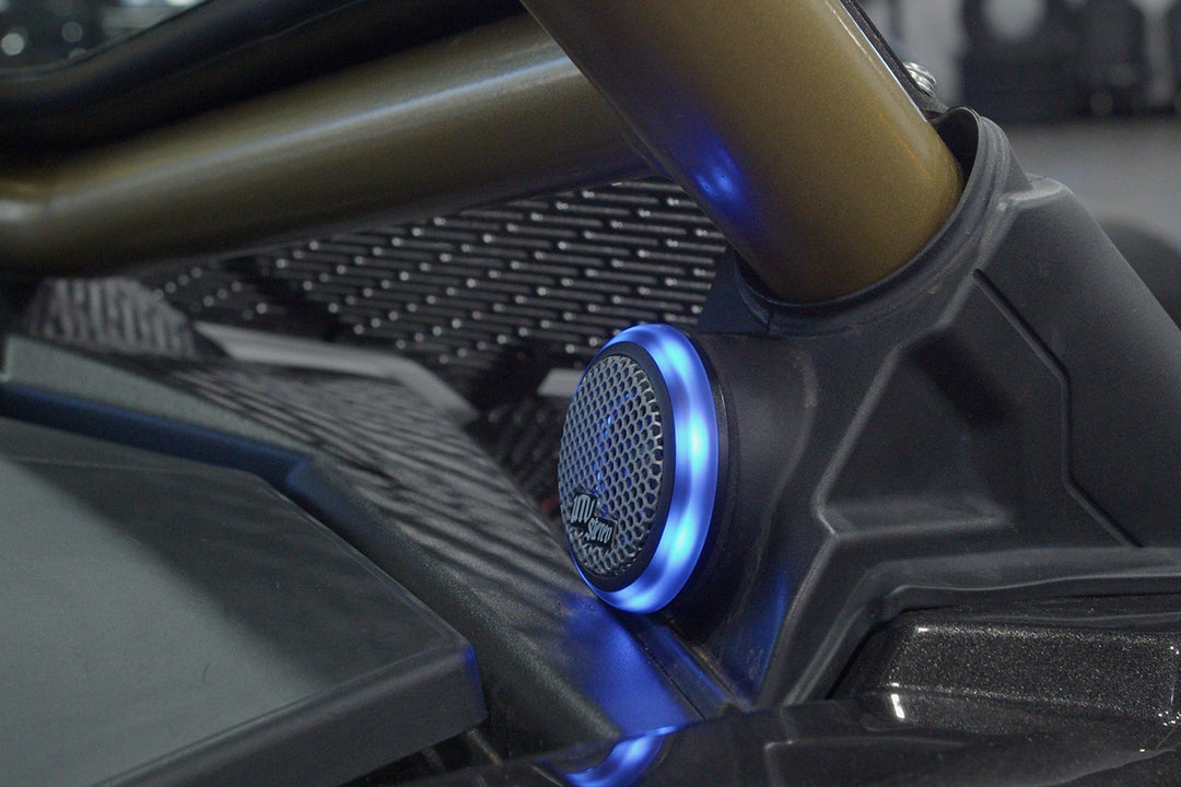 UTV Stereo speaker with blue LED ring mounted on vehicle roll cage
