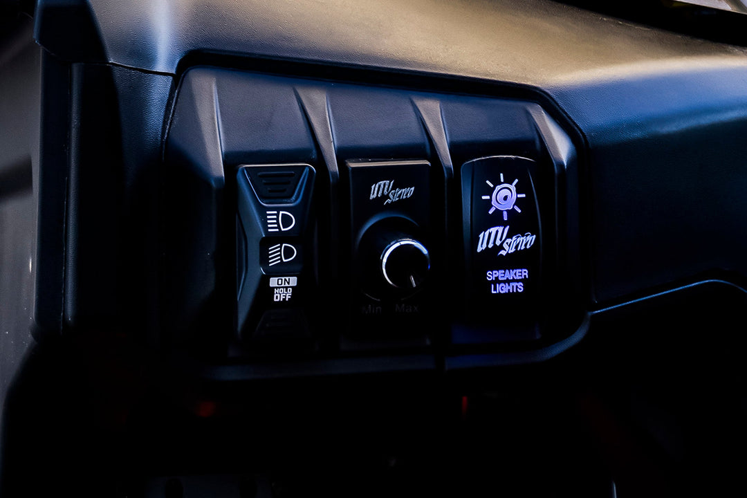 UTV Stereo dashboard control panel with headlight switch, volume knob, and speaker light switch