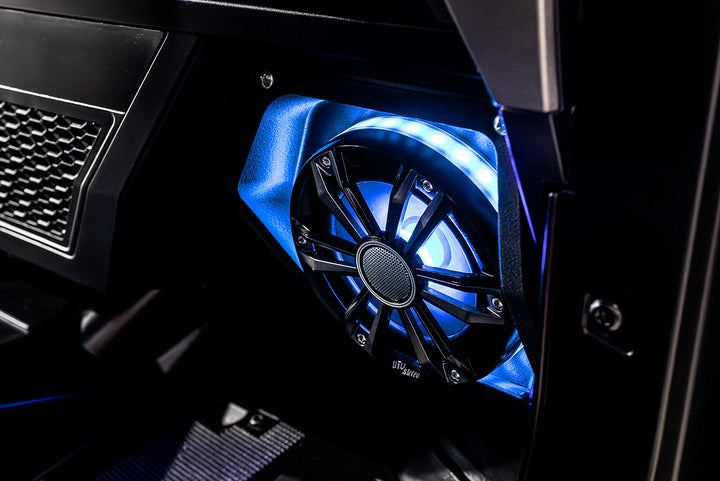 UTV Stereo speaker with blue LED ring lighting installed in a vehicle panel