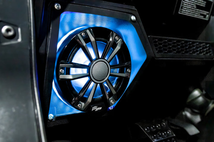 UTV Stereo speaker with blue LED backlight mounted in a black vehicle panel