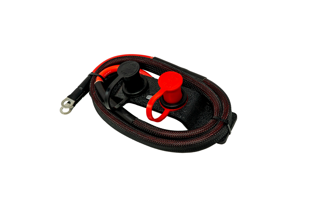 Remote battery charging studs with black and red cables