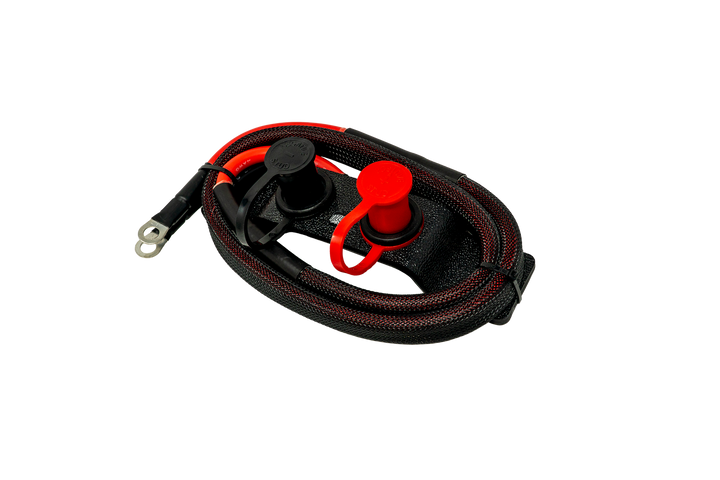 Remote battery charging studs with black and red cables