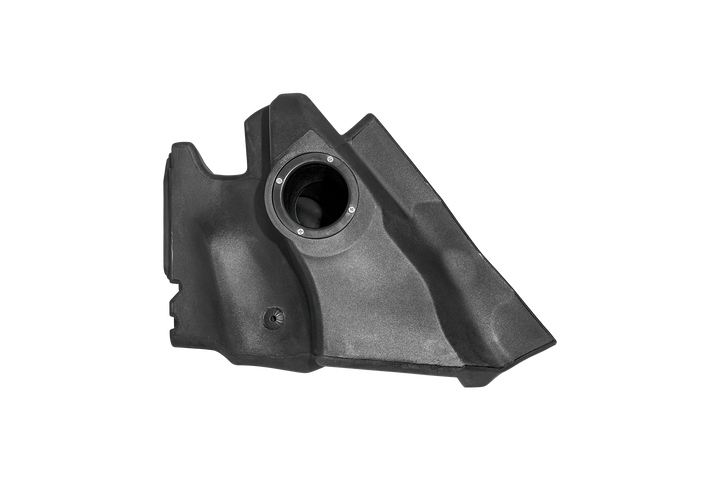 Black plastic automotive air intake housing with circular opening