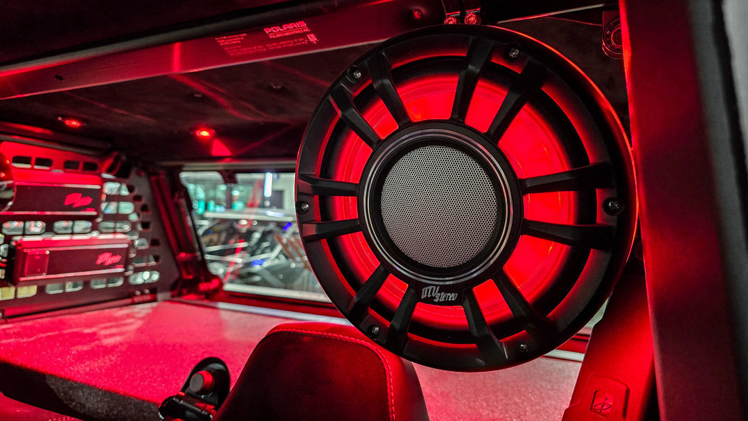 UTV Stereo speaker with red LED lighting mounted in a vehicle