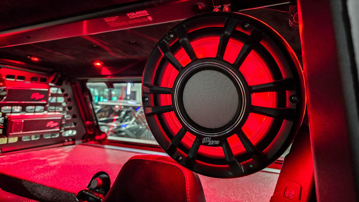 UTV Stereo speaker with red LED lighting mounted in a vehicle