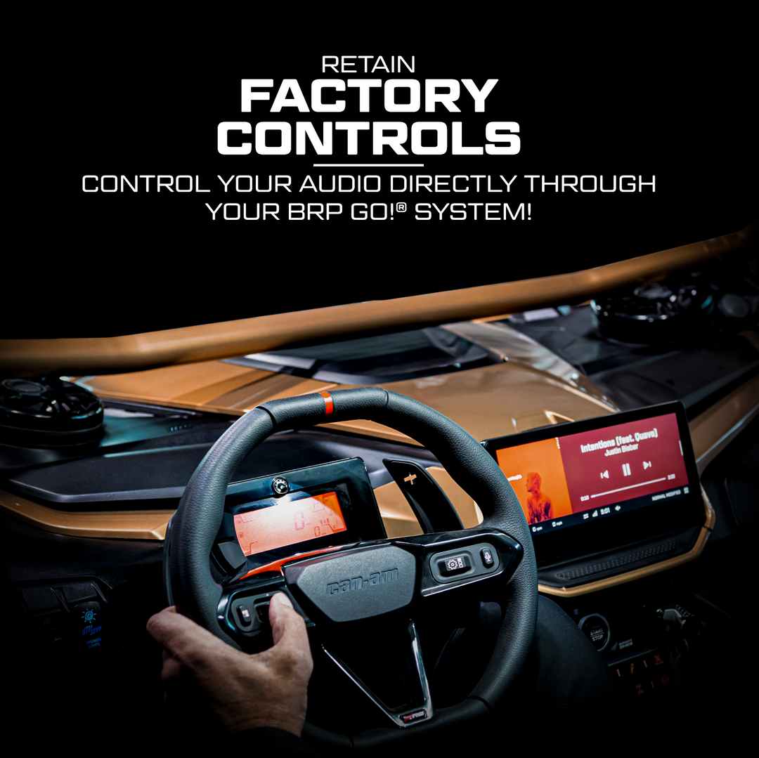 Car interior with steering wheel and dashboard displaying audio controls, text overlay about factory controls.