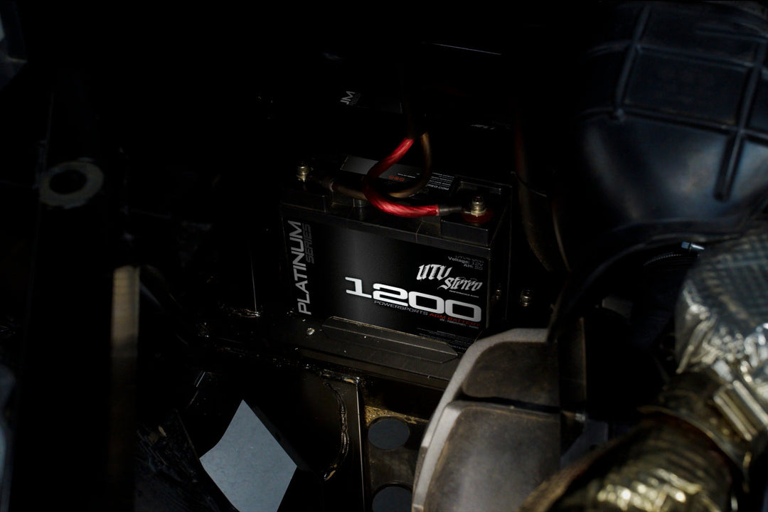 UTV Stereo Platinum Series 1200 AGM battery installed in a vehicle engine bay