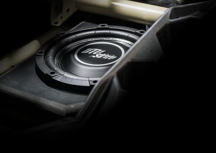 UTV Stereo subwoofer installed in a vehicle enclosure