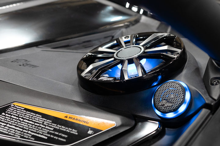 Wet Sounds marine speakers with blue LED lighting installed on a vehicle dashboard