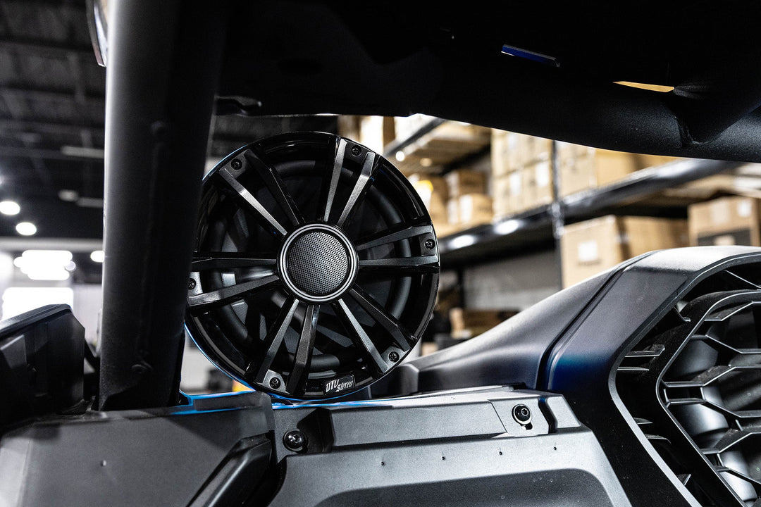 UTV Stereo black circular speaker mounted on a vehicle roll cage