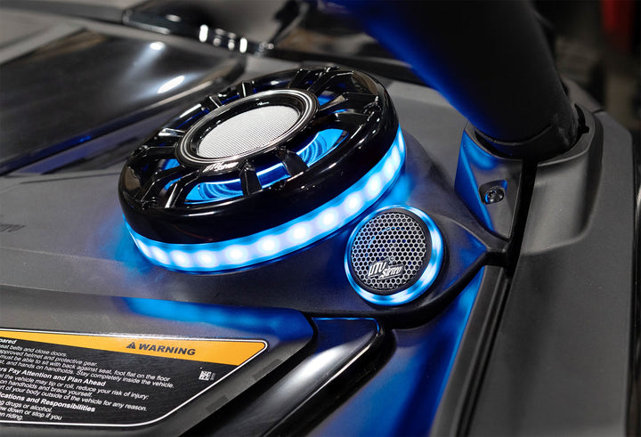 UTV Stereo speaker system with blue LED ring lighting installed in a vehicle dashboard