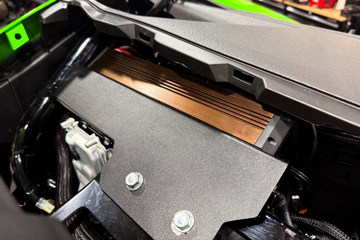 UTV Stereo amplifier mounted under the dashboard of a vehicle