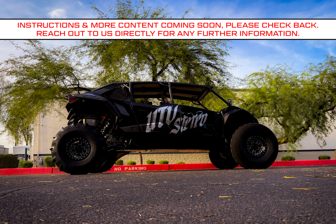 Black UTV Stereo branded off road vehicle parked in a lot