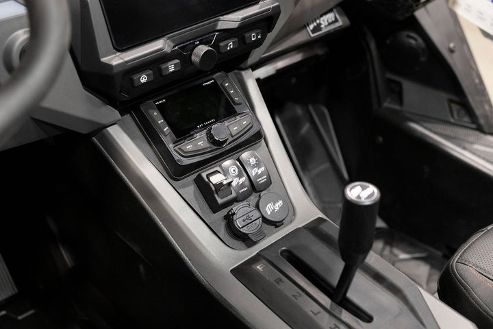 Wet Sounds audio controller and UTV Stereo switches installed in a vehicle center console