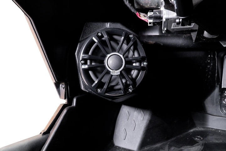 UTV Stereo speaker mounted in a vehicle interior panel