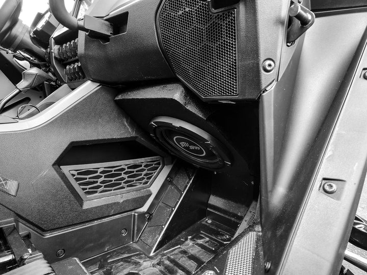 UTV Stereo subwoofer installed in the footwell of a vehicle