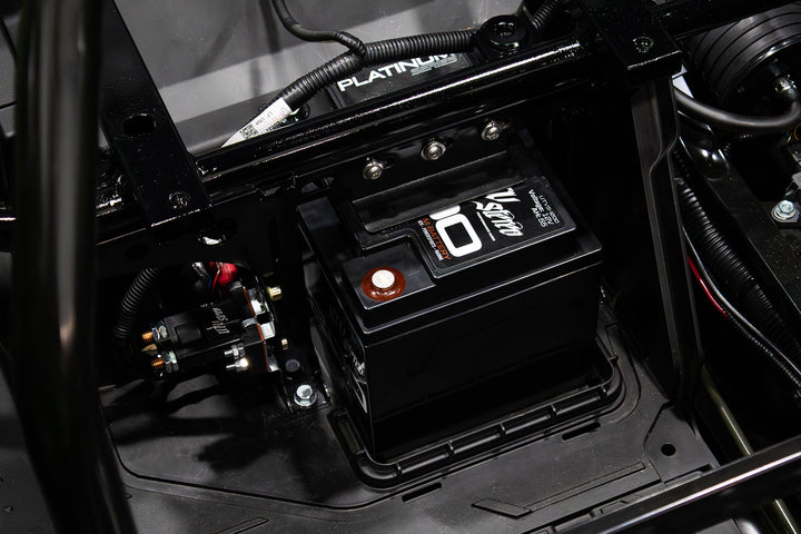 V Stereo 12V battery installed in a vehicle chassis