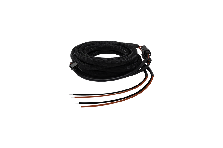 Coiled black braided electrical wiring harness with exposed wire ends and connectors