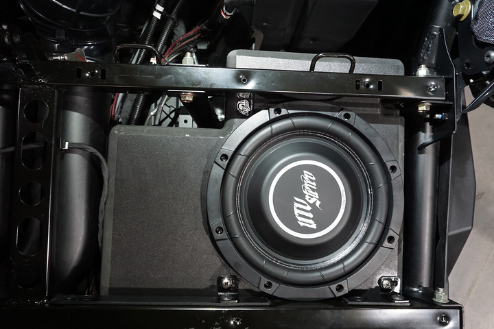 UTV Stereo low profile subwoofer mounted in a vehicle frame