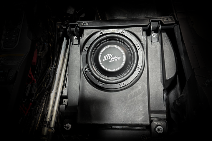 UTV Stereo subwoofer installed in a vehicle enclosure